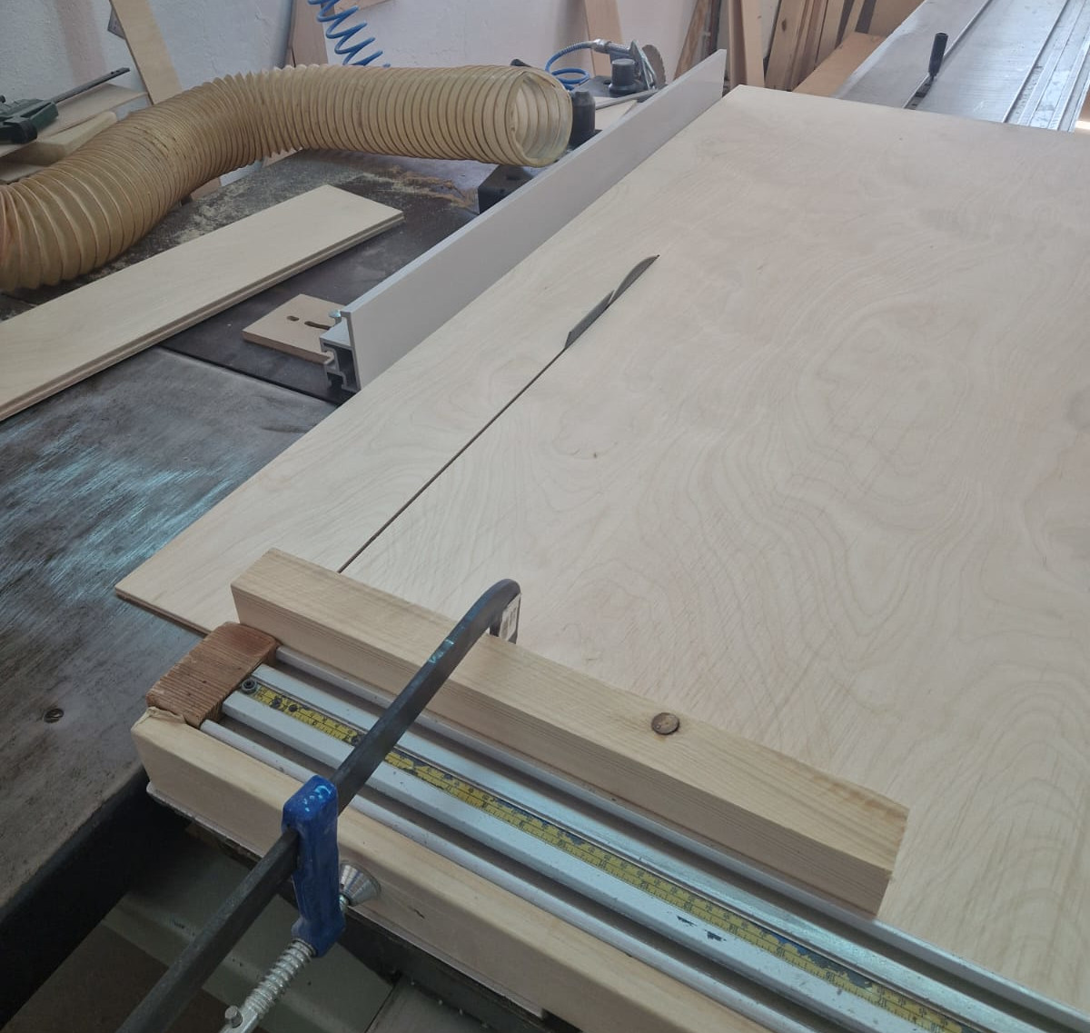 Cutting a large wooden board with a table saw